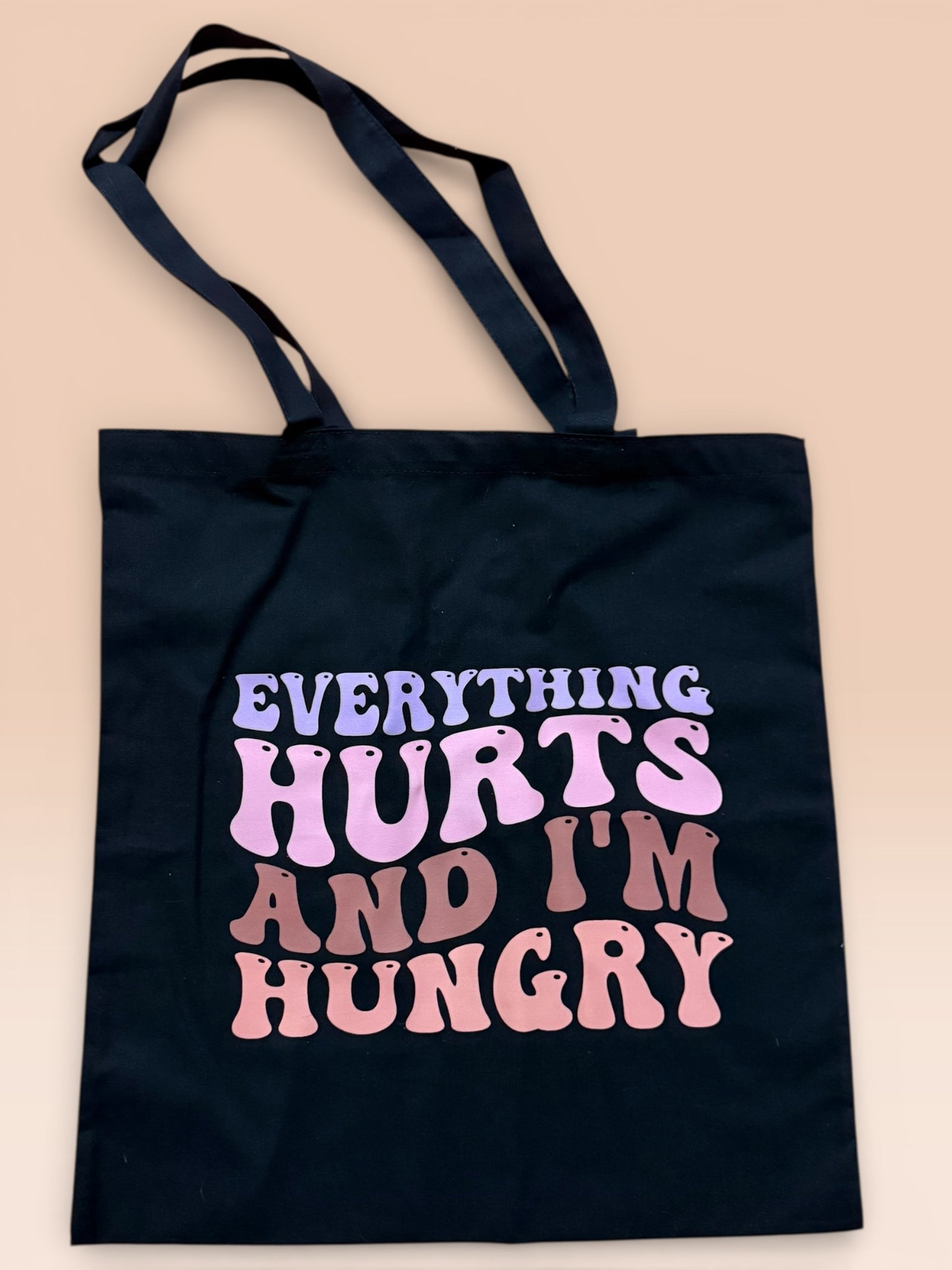 Everything hurts tote bag