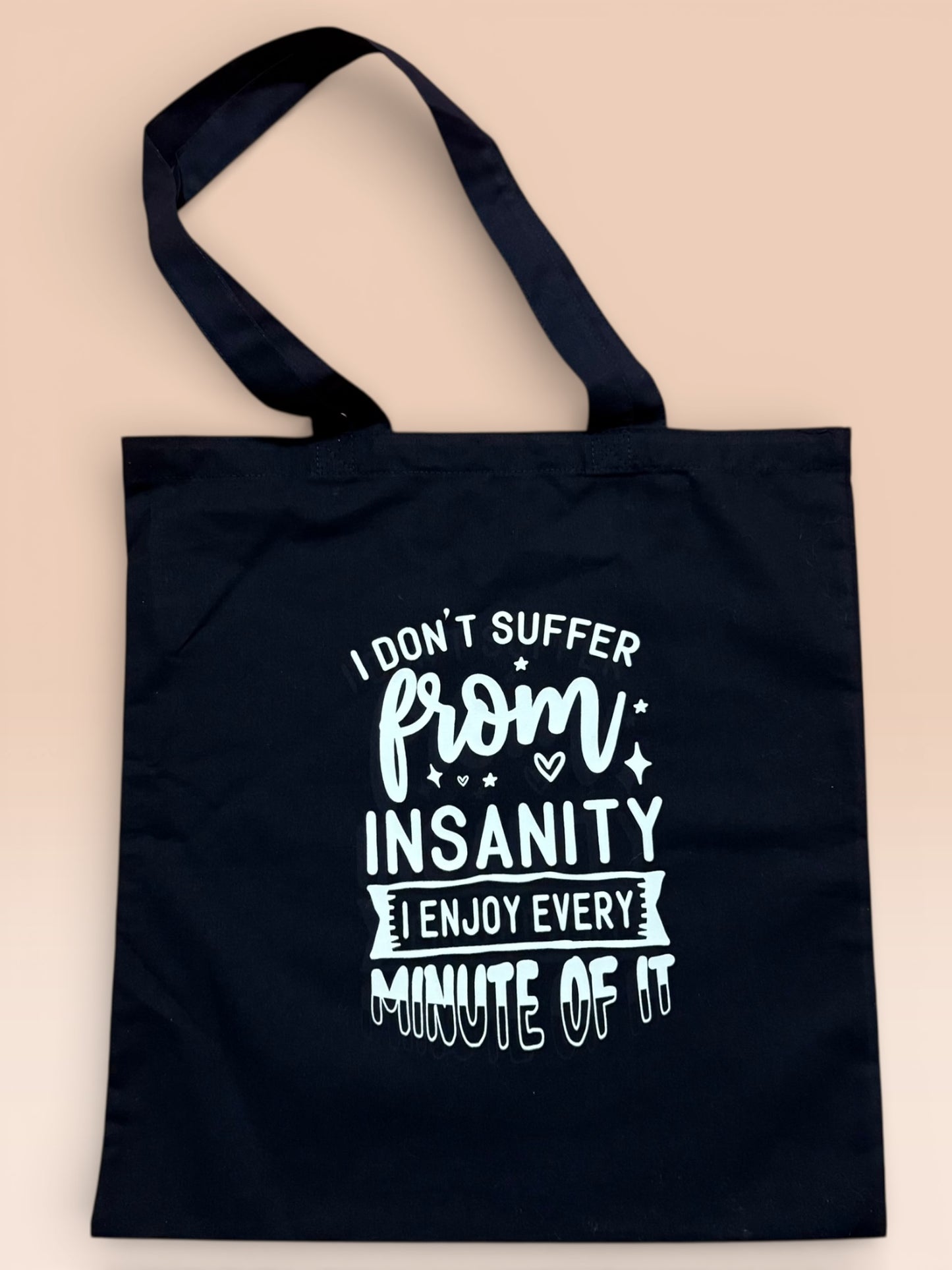 I don't suffer from insanity tote bag